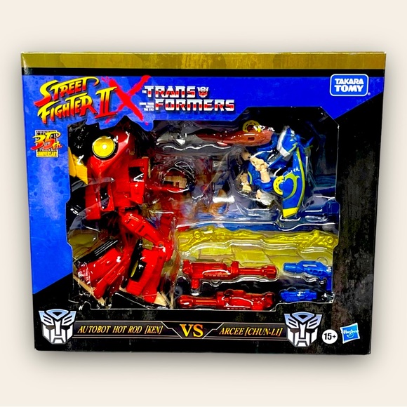 Street Fighter II X Transformers: Autobot Hot Rod (Ken) vs Arcee (Chun-Li) - Picture 1 of 6